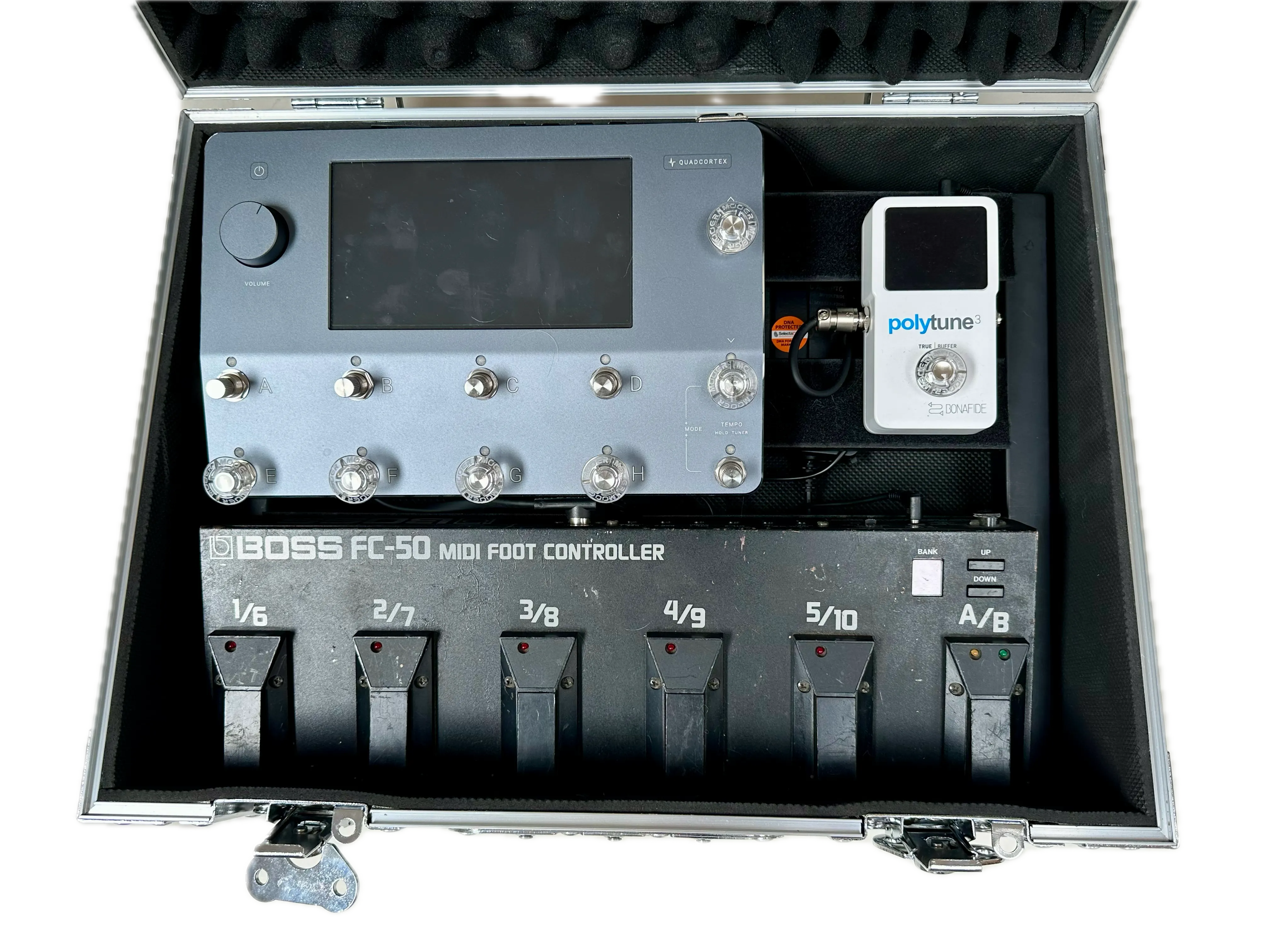 Quad Cortex pedalboard with wide spaced footswitches stored inside protective tour case